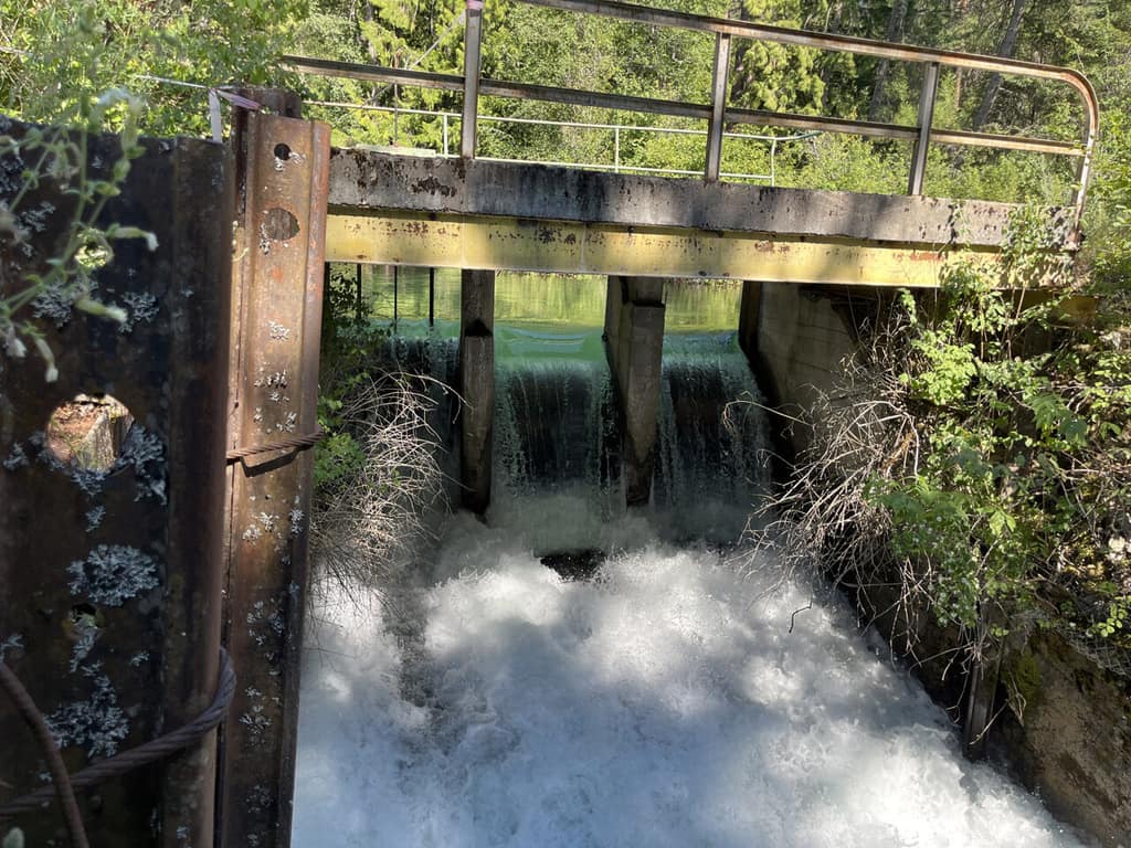 Water pouring through an irrigation structure on South Crow Creek