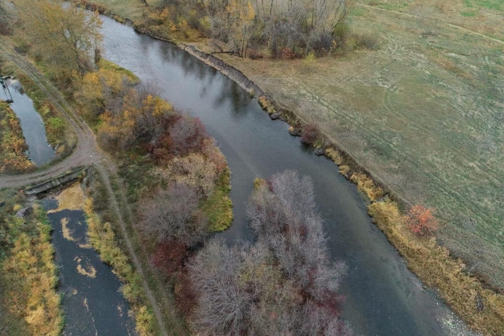 Aerial view of the Jocko River beside an irrigation canal